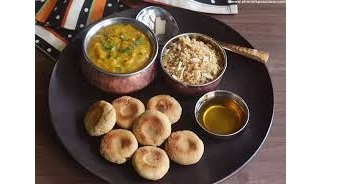 Which sweet dish complements the following delicacy from Rajasthan?